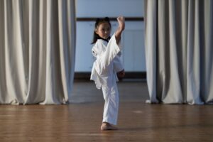 Cute Girl Doing High Kick, which is the best martial art for your child