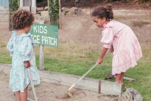 a couple of girls cleaning the ground. life lessons
