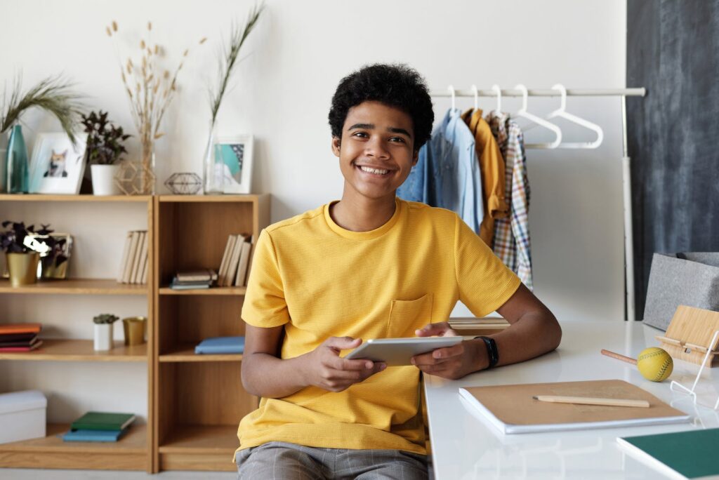 Boy in Yellow Crew Neck T-shirt Sitting on Chair, self-image